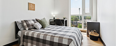 Student studying in his fully furnished room.